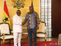 President John Mahama in a handshake with Nana Akufo-Addo