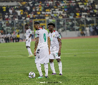 Jordan Ayew and Kudus Mohammed preparing to take freekick