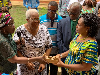 Mrs. Amissah-Arthur presenting the items to the school officials