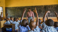 Pupils in class with their teacher