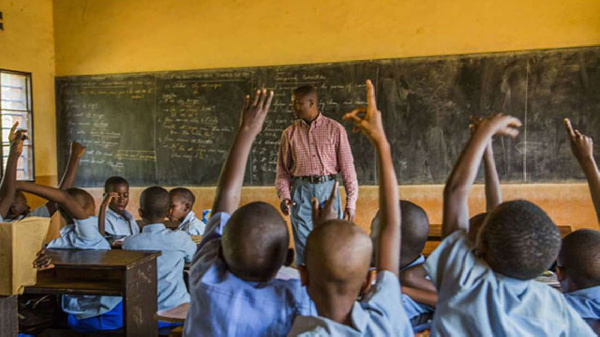 Pupils in class with their teacher