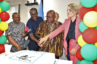 Minister for health and other dignitaries cutting the anniversay cake to mark the launch