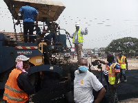 Nii Kwatei Titus Glover inspecting ongoing road construction