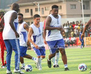 President Weah (left) joins African legends during warm up