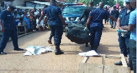 Police carrying a body. File photo