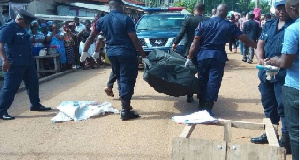 Police carrying a body. File photo