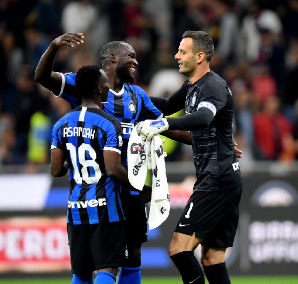 Ghanaian midfielder, Kwadwo Asamoah in a celebration with some of his teammates