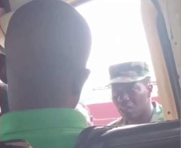 The officer was recorded while speaking to some trotro passengers