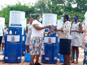 Mrs Betty Aduhene-Chinbuah, Headmistress of the school receiving the items,