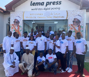 A group picture of employees at Lema Press, Sheikh Armiyaw Shaibu, and Alhaji Latif Abdulsalam