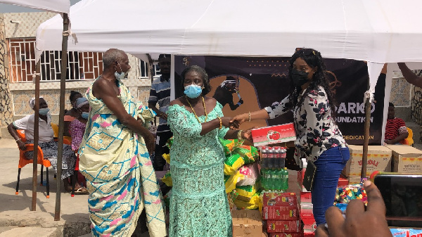 Lady Apostle Mrs. Janet Sasu making the donation to the Queen Mother