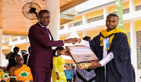 Mr  Kennedy  Awuah receiving his award