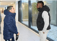 Inaki Williams chats with a club official