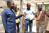 DCE for Kwahu East, Isaac Agyapong with others during their visit to an ongoing project site