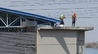 Inmates bin climb on top di roof of di Litoral prison as one big kasala burst