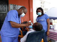 Dentists treating a patient