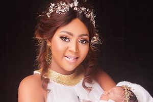 Regina Daniels and her baby