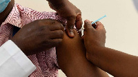 A Kenyan health worker receives a dose of the Oxford/AstraZeneca vaccine at Kenyatta National Hosp