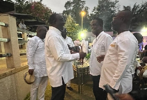 Alan Kyerematen confers with Kwesi Pratt and other guests