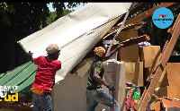 Some workers trying to salvage what is left of the building