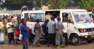 File photo of passengers struggling for a car