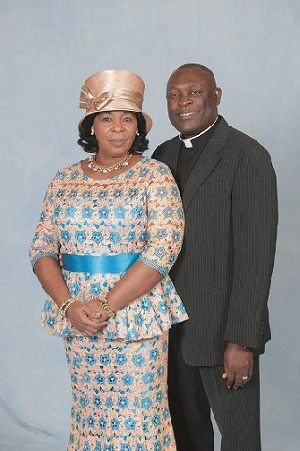 Apostle Kusi poses with the wife