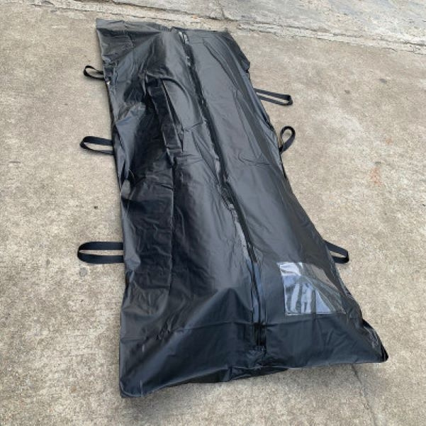 Remains of the deceased in a body bag