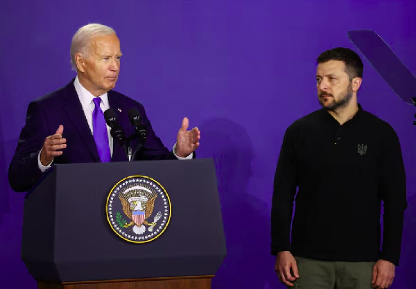 Joe Biden and Volodymyr Zelenskiy [REUTERS/Yves Herman]