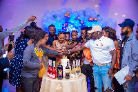 Akuapem Poloo flanked by some celebrities and friends