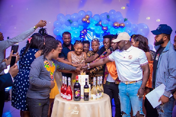 Akuapem Poloo flanked by some celebrities and friends