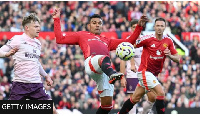 Manchester United midfielder Casemiro stretches for the ball