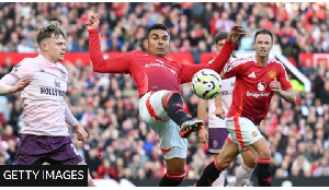 Manchester United midfielder Casemiro stretches for the ball