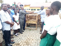 Municipal Chief Executive for Jomoro, Ernest Kofie handing over the items to George Blay Morkeh