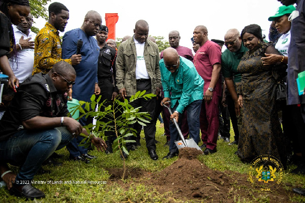 The president is joined by Samuel Jinapor, others, to plant the trees