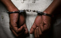 File photo: A suspect in handcuffs