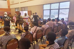 Nana Boakye and some NPP officials speaking to some SHS students