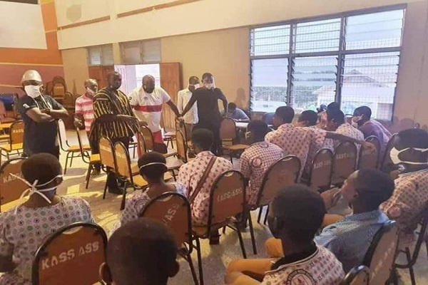 Nana Boakye and some NPP officials speaking to some SHS students