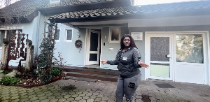 Tracey Boakye in a pose in front of her Germany apartment