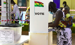 A file photo of a woman casting her vote