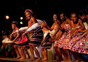 African Women in their local attires dancing during a stage performance to entertain their guests