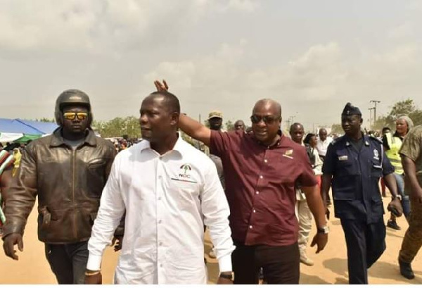 Former President John Dramani Mahama waves constituency members