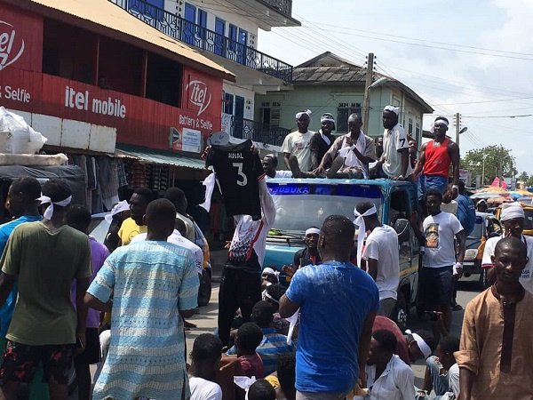 Awal being driven through some streets in Cape Coast