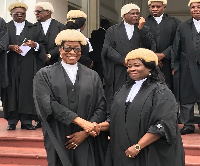 Justice Sophia Akuffo, the Chief Justice in a handshake with Justice Sophia Adinyira