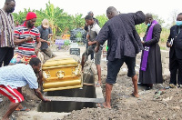 Coffin of Lizzy Mudenda being lowered