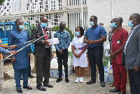 George Swanzy Winful presenting the medical items to the various health representatives