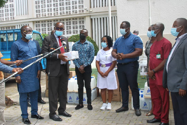 George Swanzy Winful presenting the medical items to the various health representatives