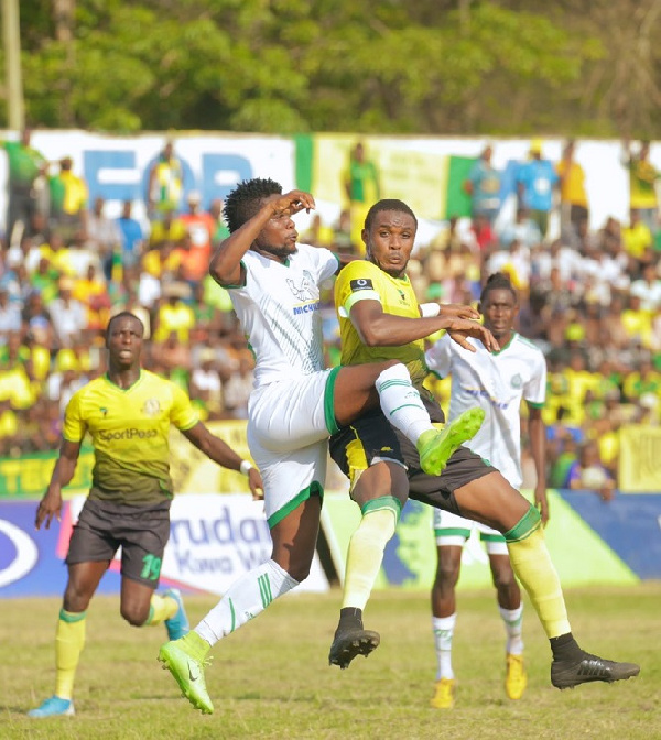 Defender, Lamine Moro in action (R)