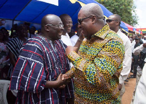 Former President John Dramani Mahama in a handshake with Vice President, Mahamudu Bawumia