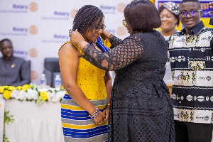 Matilda Adukuma Adomolga-Adageba receiving the official Chain of Office from Nana Esi Adade Amankwah