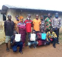 Members of the Co-operative displaying their certificates